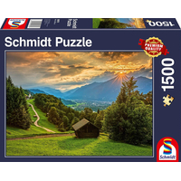 SCHMIDT Puzzle Západ slnka nad horskou dedinou Wamberg 1500 dielikov