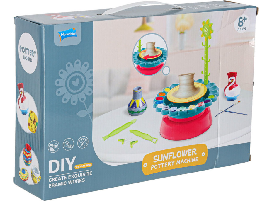 Hrnčiarsky kruh s hlinou a farbami