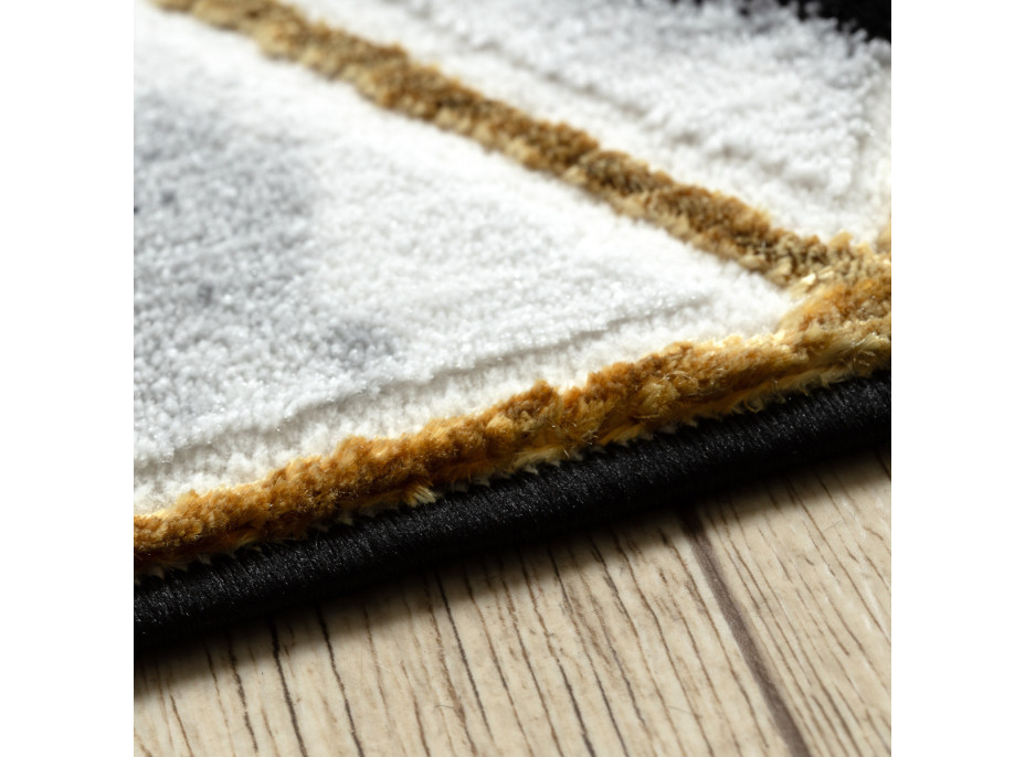 Kusový koberec Allure 1966 black/gold